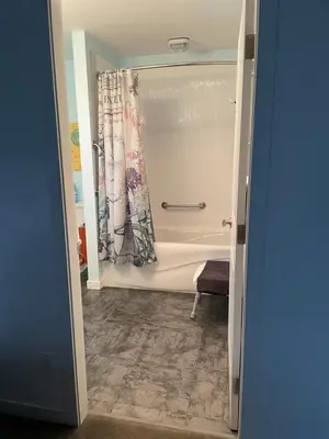 a bathroom with a shower and a bath tub at Oyster River Guest Room in Campbell River