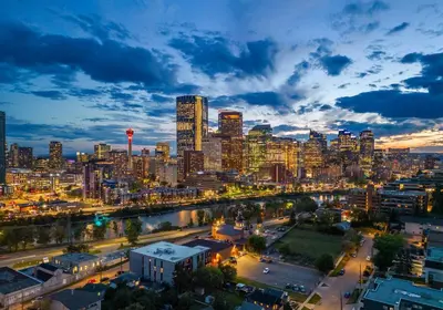 a view of a city skyline at night at Bow River Cabin - Downtown - River Front - Free Street Parking in Calgary