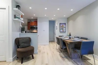 a kitchen and dining room with a table and chairs at Whistler Village North Retreat - Private Hot tub in Whistler