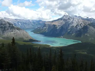 a lake in the middle of a mountain range at Newly Built 2BR Mountain Escape in DT Canmore! in Canmore