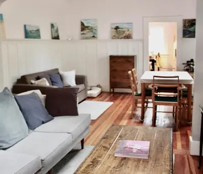a living room with a couch and a table at Craftsman Home in popular East Village in Vancouver