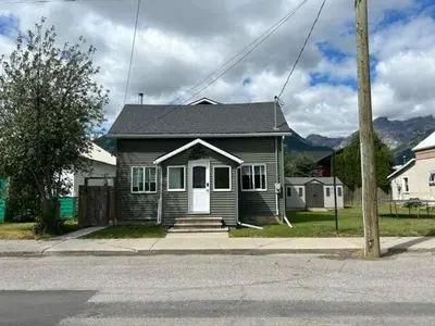 a small house on the side of a street at 2 BDRM Homes on 2nd Avenue in Fernie