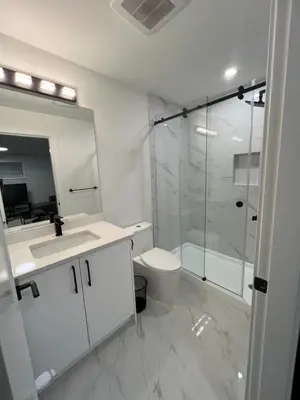 a bathroom with a shower and a toilet and a sink at Calm & Cozy Private Suite in Surrey