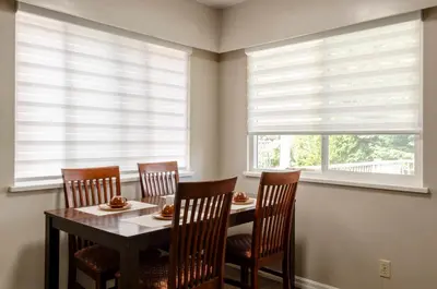 a dining room with a table and chairs and windows at Oak Park House in Vancouver in Vancouver