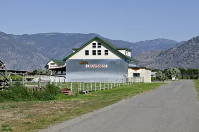 a barn on the side of a road at Crowsnest Vineyards Guesthouse in Keremeos