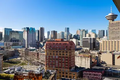 a view of a city skyline with a tall building at Luxury Central Apartment with City Views in Vancouver