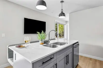 a kitchen with a sink and a window at Charming 2BR Haven in Canmore Near DT and Banff in Canmore
