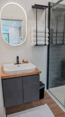 a bathroom with a sink and a mirror at Skyridge Glamping in Kananaskis Village