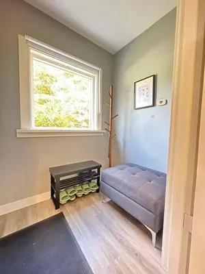 a living room with a couch and a window at Spacious 4BR Retreat near YVR and DT in Vancouver
