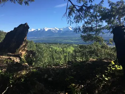 a view of the mountains from the top of a hill at Bluesky Lodge in Golden