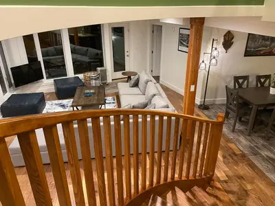 a living room with a couch and a table at Bluesky Lodge in Golden