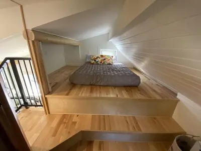 a staircase with a bed in a room at Alder House in Golden