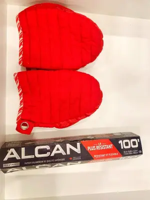 two red towels and a toothbrush on a shelf at Cozy Guest Suite Near University of Alberta, Southgate Mall, and Downtown in Edmonton