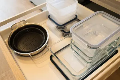 an open refrigerator with a tray with containers and a bowl at North Vancouver Retreat, Cozy & Central, Walk to Lonsdale & Seabus in North Vancouver