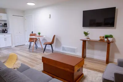 a living room with a couch and a table at The Vida 1 Bed Pet-Friendly in Abbotsford
