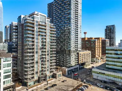 an aerial view of a city with tall buildings at Urban Oasis - 2BR Condo Downtown Large Balcony in Calgary