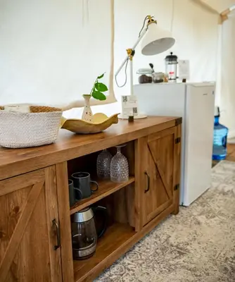 a kitchen with a wooden counter and a refrigerator at Haida Gwaii Glamping in Tlell