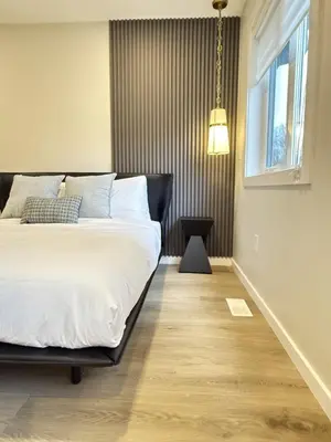 a bedroom with a large bed and a window at Memory Lodge in Canmore