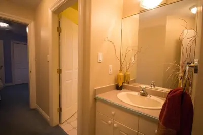 a bathroom with a sink and a mirror at Eagle Close Executive B&B in Prince Rupert