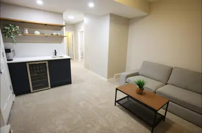 a living room with a couch and a table at Cozy 2BR Private Basement Suite, Free Parking, WiFi, 1 Hr to Banff, 20 Min to City in Calgary