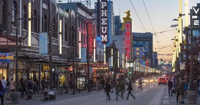 a busy city street with people walking on the street at Gorgeous Unit in the Heart of Downtown in Vancouver