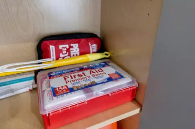 a stack of plastic containers on a shelf with chopsticks at Vancouver Cozy Cove in Vancouver