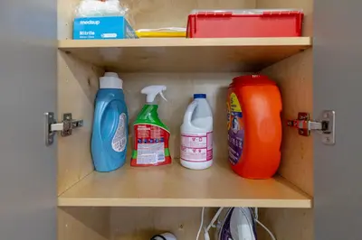 a shelf with bottles of detergent and detergents at Vancouver Cozy Cove in Vancouver