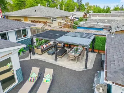 an overhead view of a patio with a table and chairs at The Experience - Pool Hot Tub Theater Games Rm Pub in Calgary