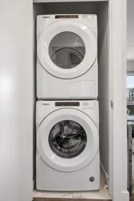 three washing machines stacked on top of each other at Winston Suite 2BR 1BA - Carriage Suite with Garage in Calgary