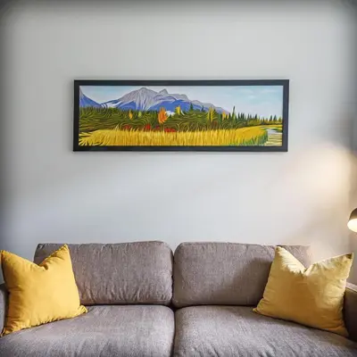 a couch in a living room with a painting on the wall at Mountain Luxe - 50 Percent Off April & May in Canmore
