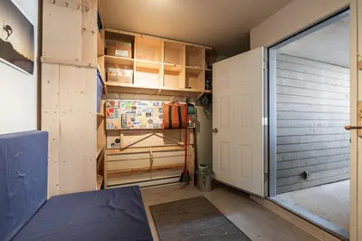 a room with a garage door and a door at Gondola Heights by Outpost Whistler in Whistler