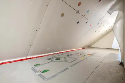 a room with a climbing wall on the floor at Radiant Retreat -Spacious Home - Heart of Radium! in Radium Hot Springs