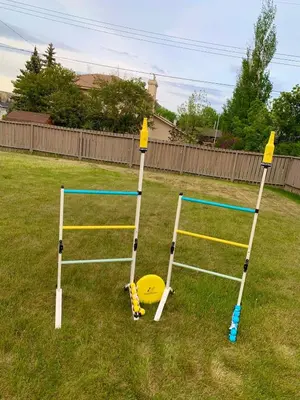 two trampolines in a yard with a frisbee at Spacious Drumheller-RetreatMuseum & Golf in Drumheller