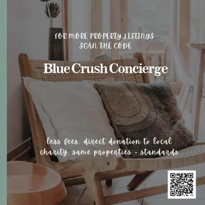 a picture of a couch with a pillow and a table at Coastal Suite - Harbourview in Ucluelet in Ucluelet