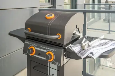 a grill on a table with a napkin at Stylish Condo with Exclusive Rooftop Pool in Calgary
