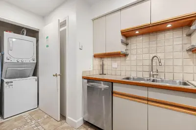 a kitchen with a sink and a refrigerator at Foxglove by Whistler Premier in Whistler