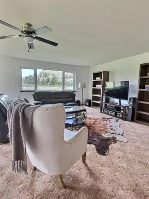 a living room with a couch and a chair at Vineyard Home Casa De Herrera in Keremeos
