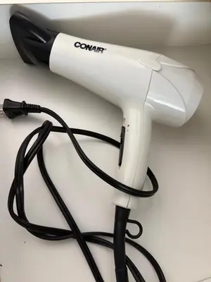 a hair dryer with a black cord on a counter at 2 bedroom Suite with private entrance in Langley