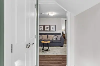 a hallway leading to a living room with a couch at Township by Canmore Premier in Canmore
