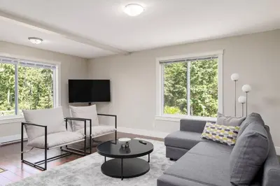 a living room with a couch and a table at Peaceful spacious 2BR Suite in Nanaimo