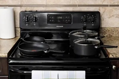 a stove with pots and pans on top of it at Peaceful spacious 2BR Suite in Nanaimo
