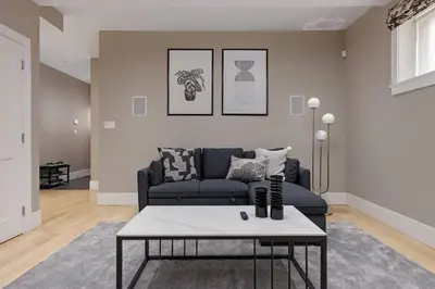 a living room with a couch and a coffee table at Charming Luxury Home near DT and Lonsdale Quay in North Vancouver