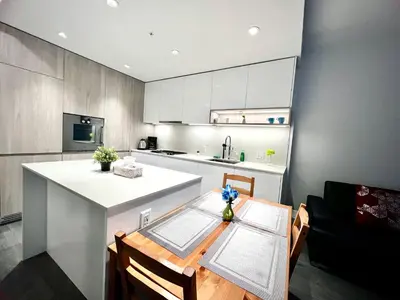 a kitchen with a table and a white counter top at Best location &comfortable room1B &1B Richmond center in Richmond