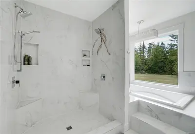 a white bathroom with a shower and a sink at Shawnigan Lake Retreat with Theatre in Shawnigan Lake