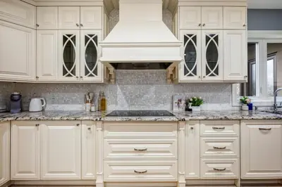 a kitchen with white cabinets and a white hood at The Royal Ravine Luxury Retreat with Hot Tub & Sauna in Calgary