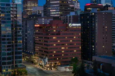 a city skyline at night with tall buildings at Element Calgary Downtown by Westin in Calgary