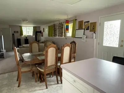 a kitchen and dining room with a table and chairs at Imperial Ranchettes GuestSuite in Lone Butte
