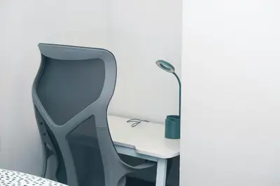 a desk with a chair and a lamp on it at Comfy & Modern 2 Bedroom Guest Suite with King Bed in Edmonton