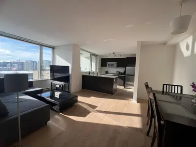 a living room with a couch and a table at Elegant &comfortable room1B &1B apartment perfect location in Richmond