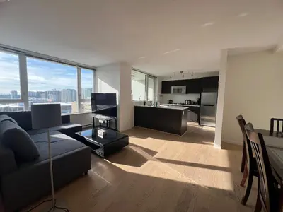 a living room with a couch and a table at Elegant &comfortable room1B &1B apartment perfect location in Richmond